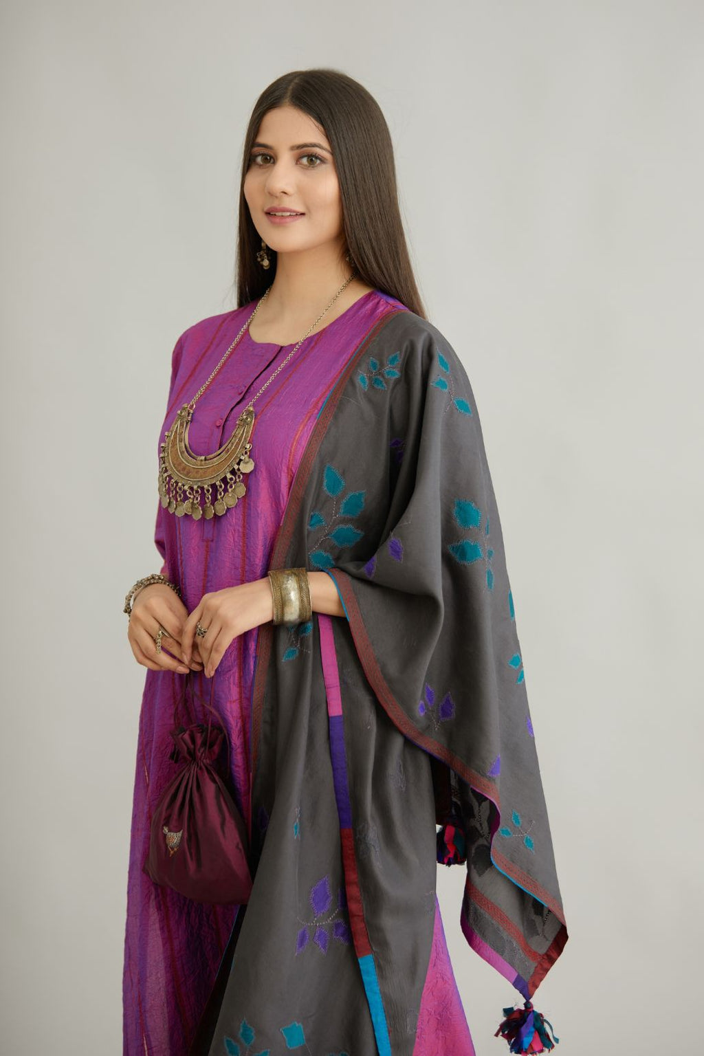 Grey hand crushed silk stole with silk fabric applique work and embroidery at edges.