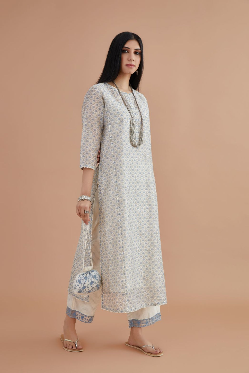 Off white silk chanderi kurta set with all-over jaal hand block print, highlighted with off white rickrack lace