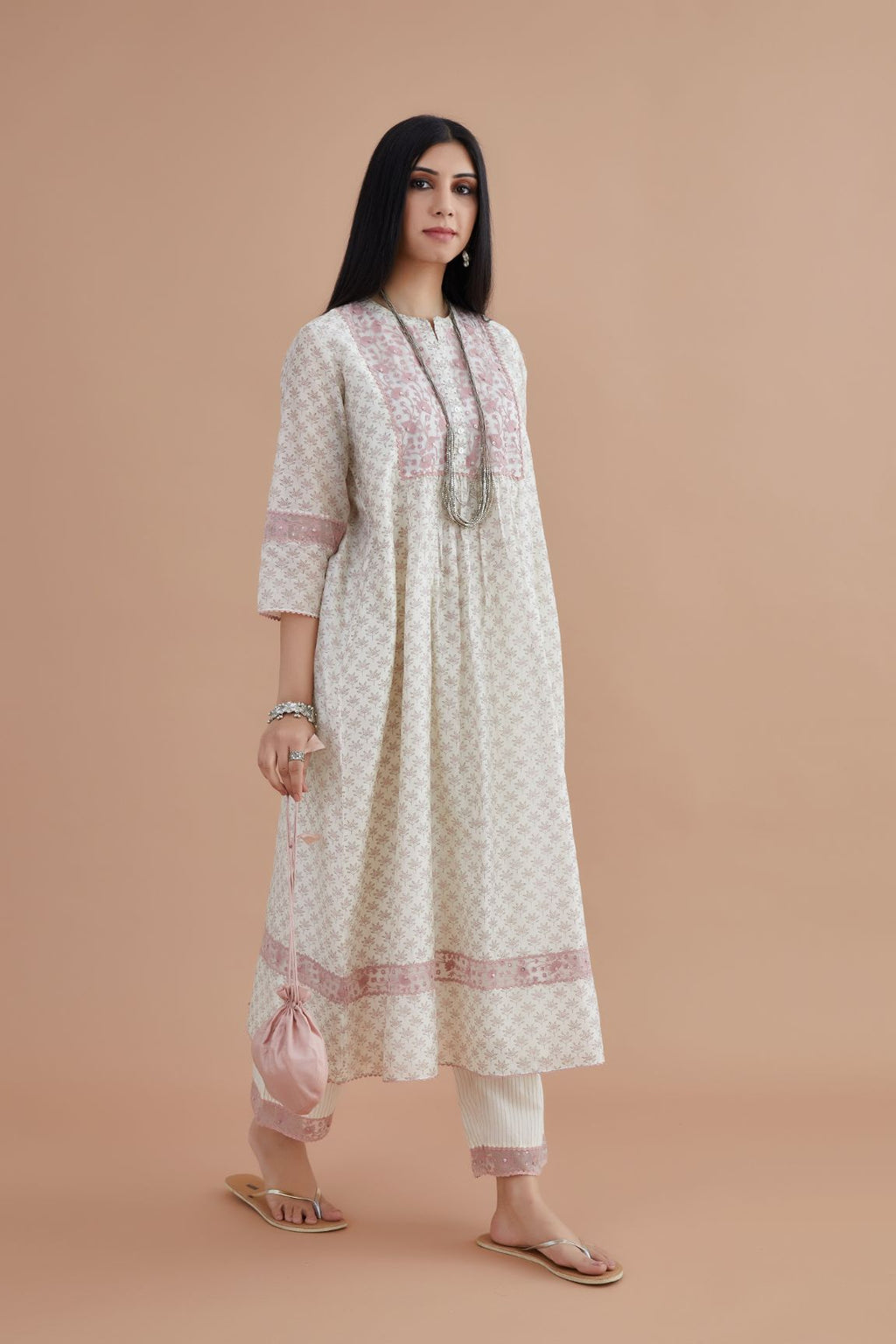 Silk Chanderi kurta set with all-over pink lotus hand block print and embroidered yoke with fine gathers at waist.