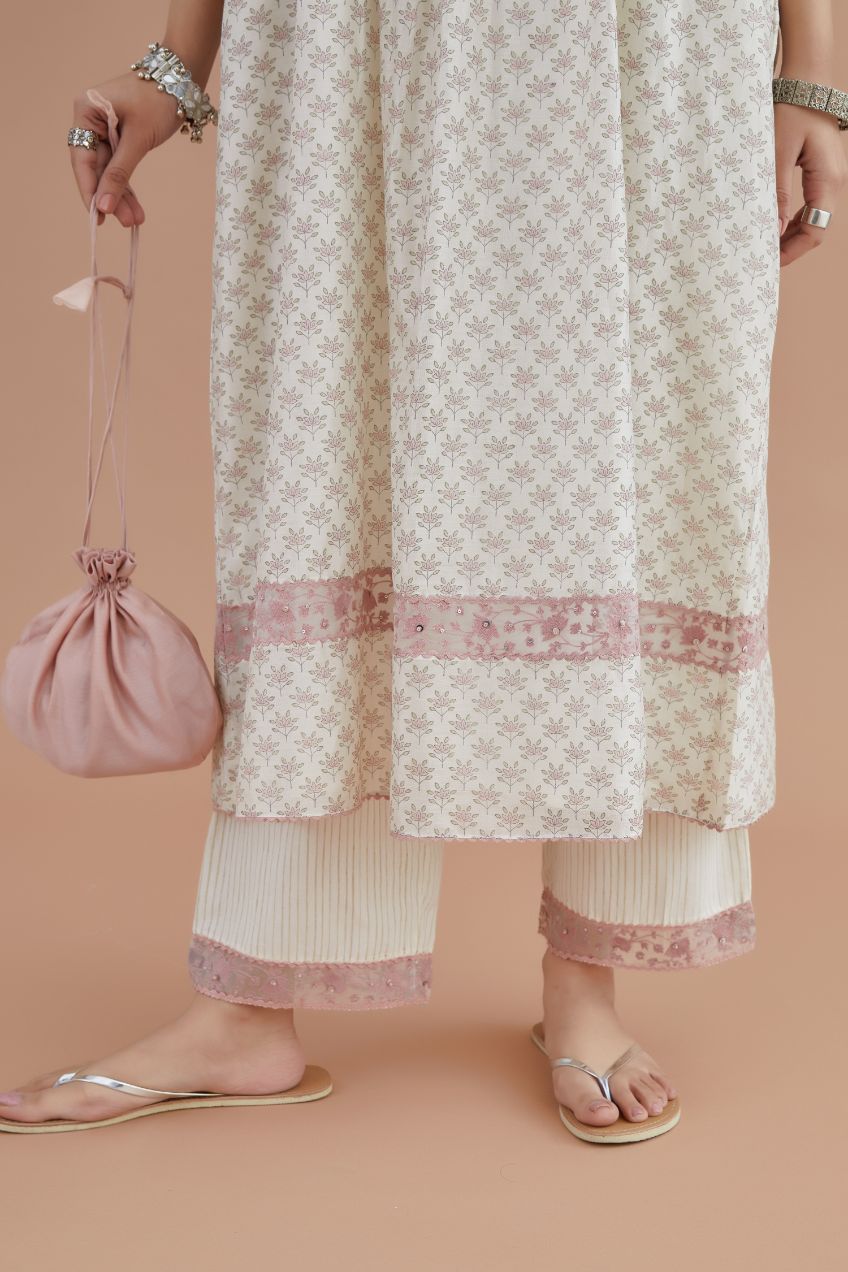 Silk Chanderi kurta set with all-over pink lotus hand block print and embroidered yoke with fine gathers at waist.