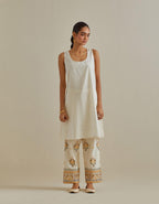 Yellow and off-white cotton chanderi A-line kurta set with all over embroidery set in bold chevron stripes.