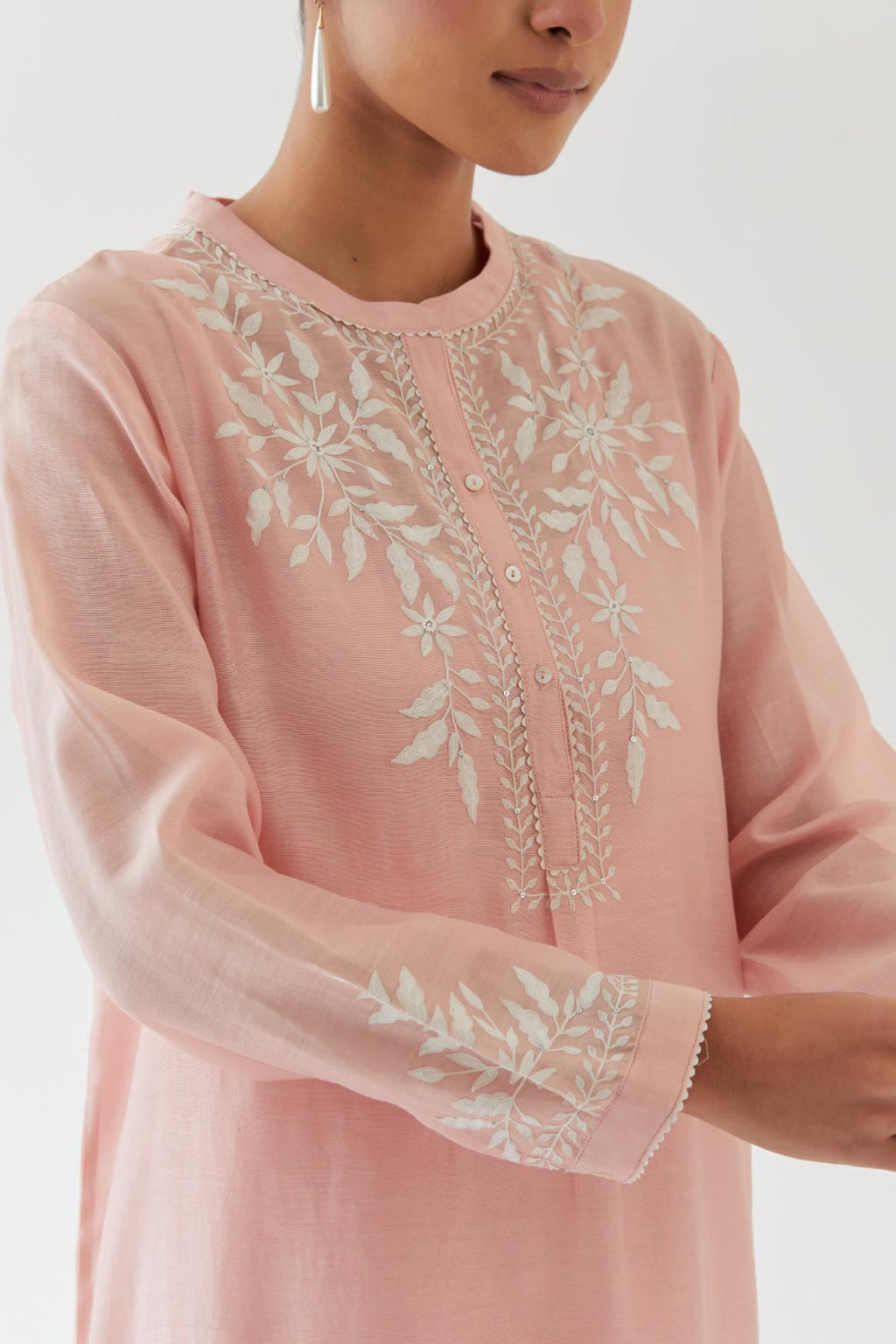 Pink silk chanderi straight short kurta set with off white thread embroidery.