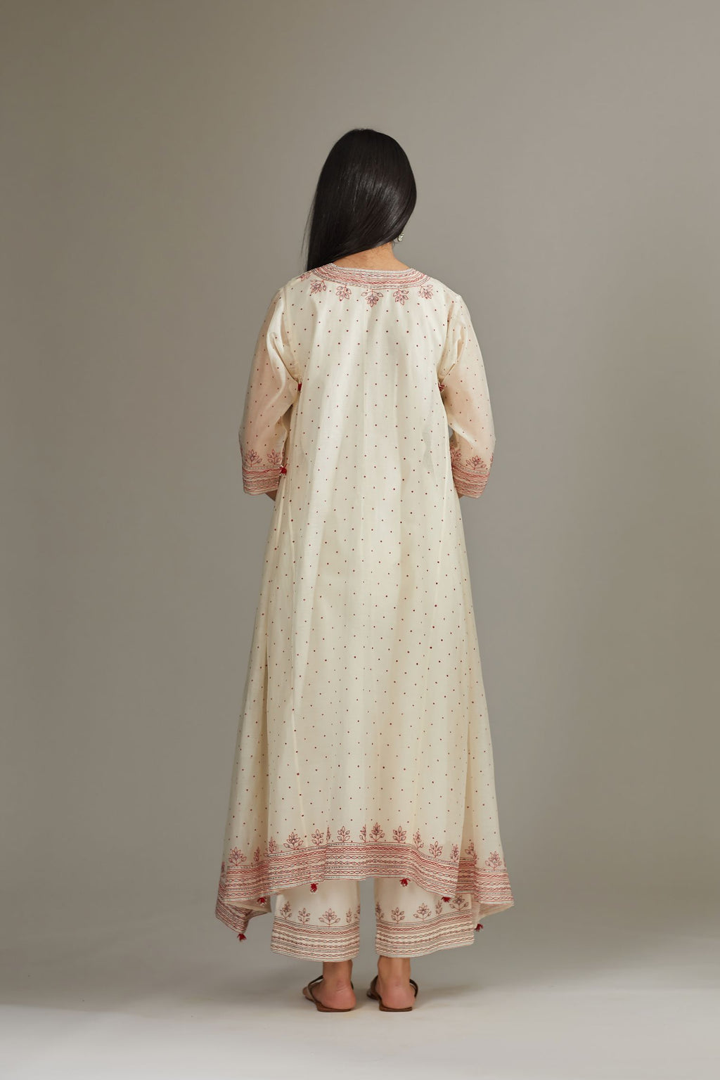 Asymmetric hand block printed kurta set with contrast quilted embroidery.