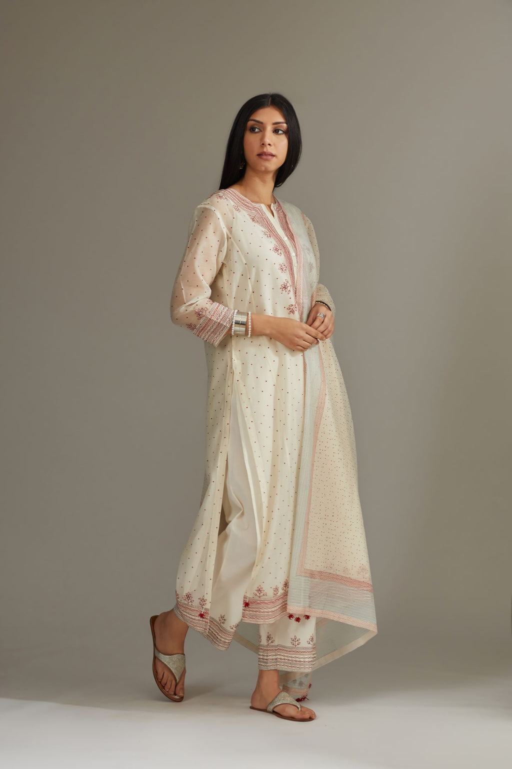 Straight kurta set with all-over hand block print and side panels highlighted with quilted embroidery.
