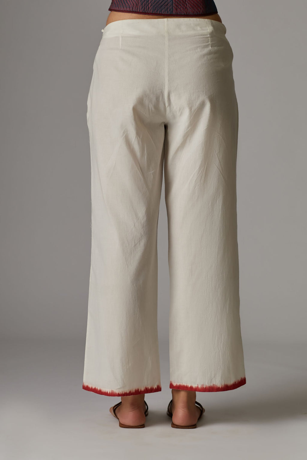 Off white straight pants with hand block print at the bottom
