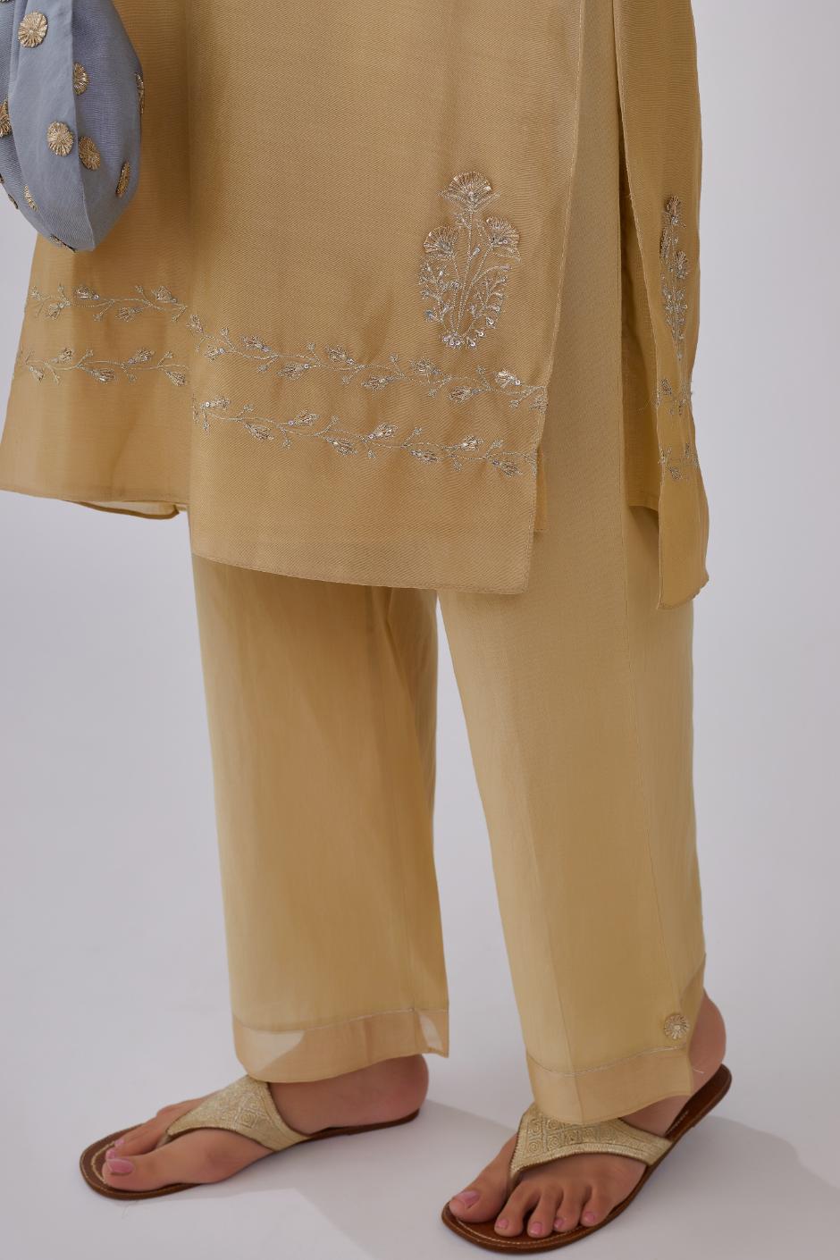 Olive silk chanderi short kurta set detailed with gota embroidery and highlighted with bugle beads and sequins.