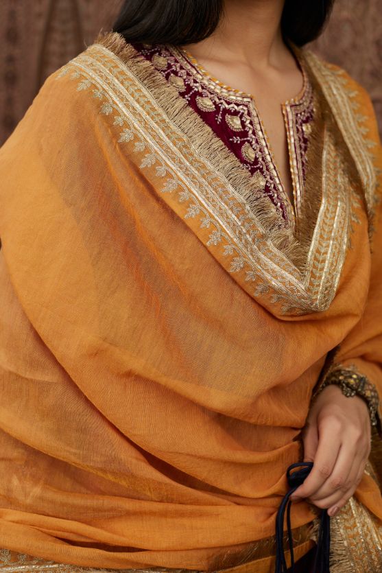 Tissue Chanderi dupatta with delicate gold zari and gota embroidery border running along all edges with large butas placed at the pallas, end pieces (Dupatta)