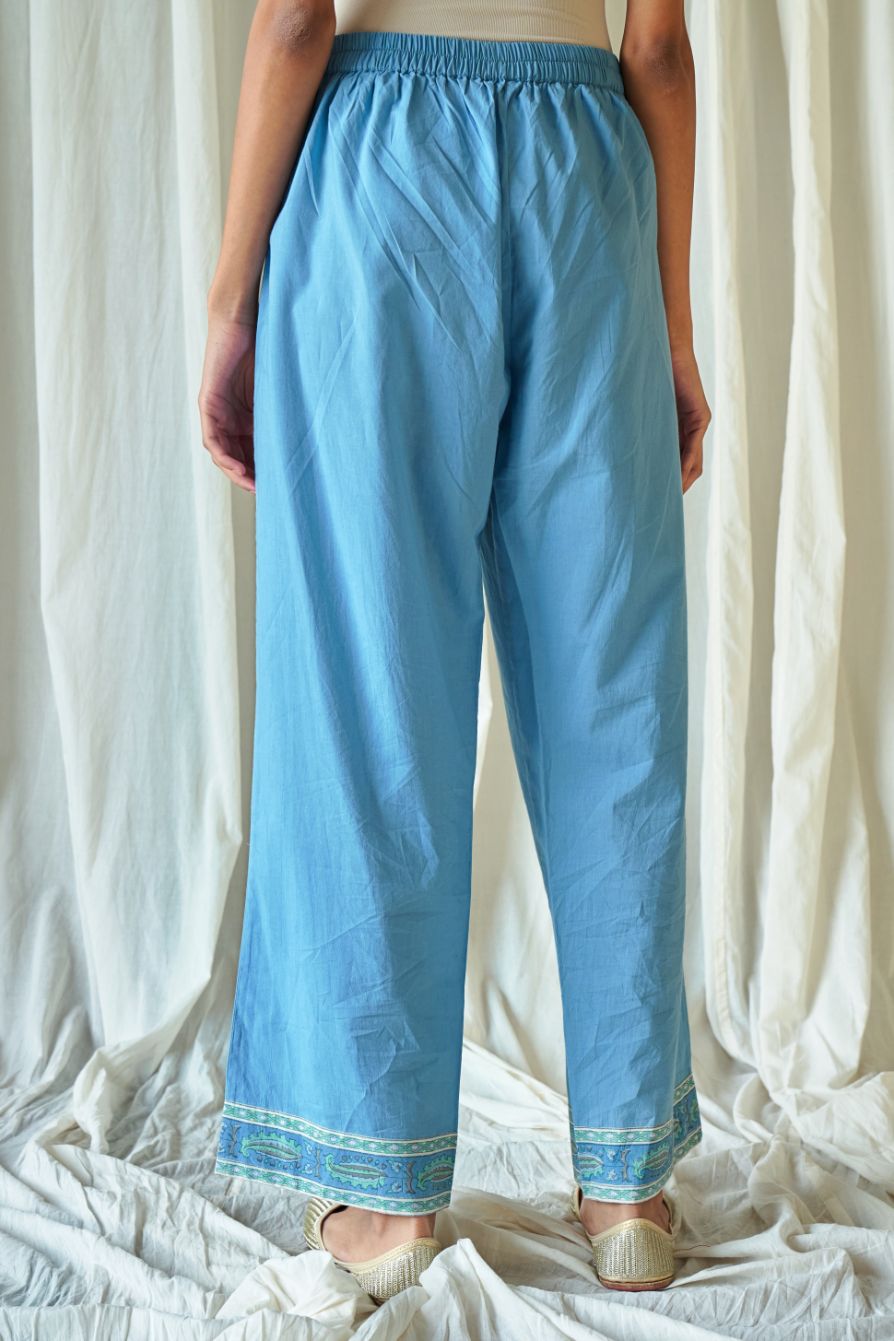 Blue straight cotton pants with hand block print at hem