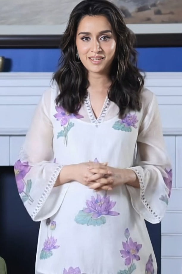 Off white cotton chanderi A-line kurta set features with all-over purple and green lotus flower hand block print.