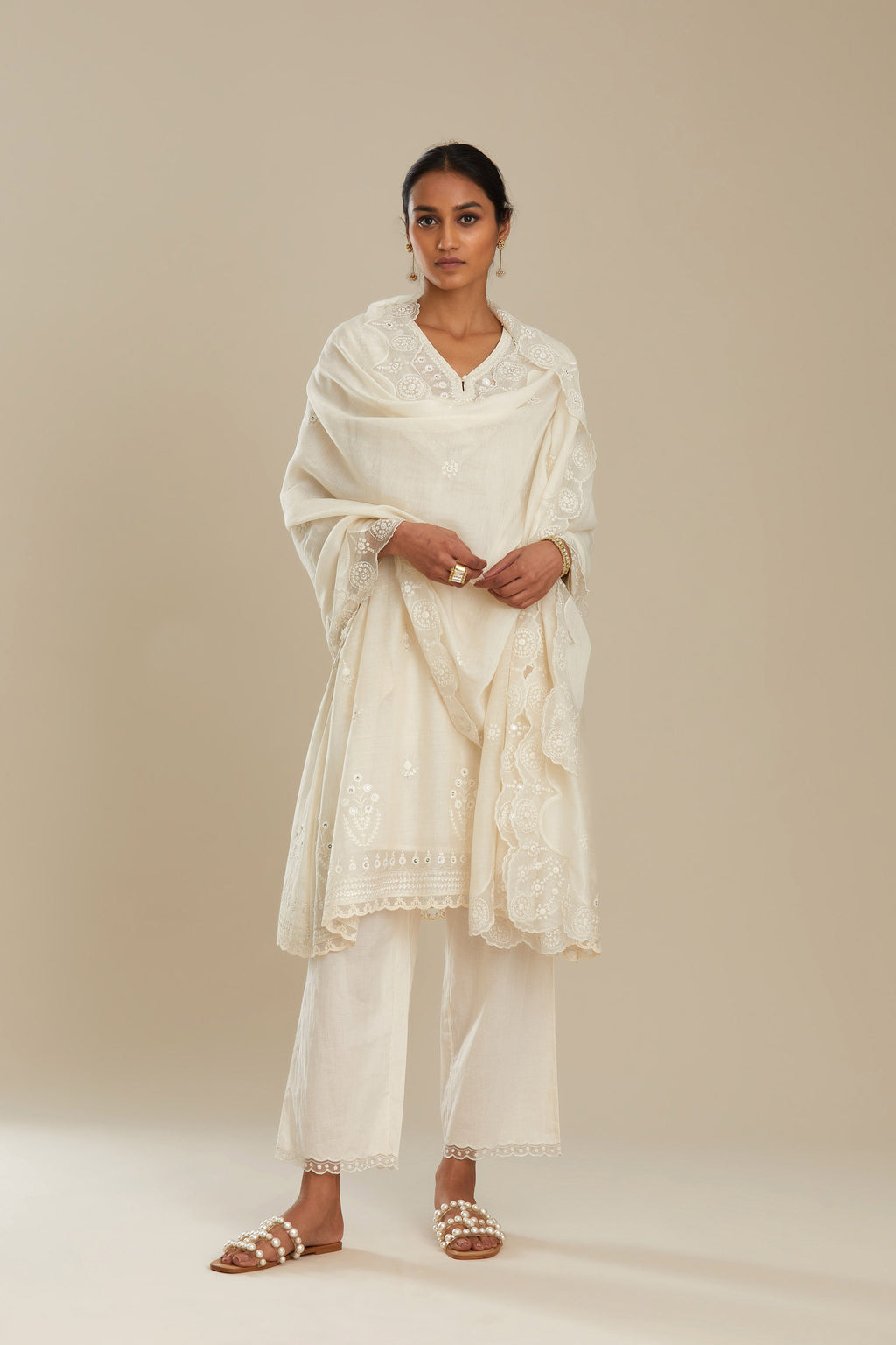Cotton chanderi easy fit short V neck kurta set with tonal silk thread embroidery, highlighted with sequin and beads.