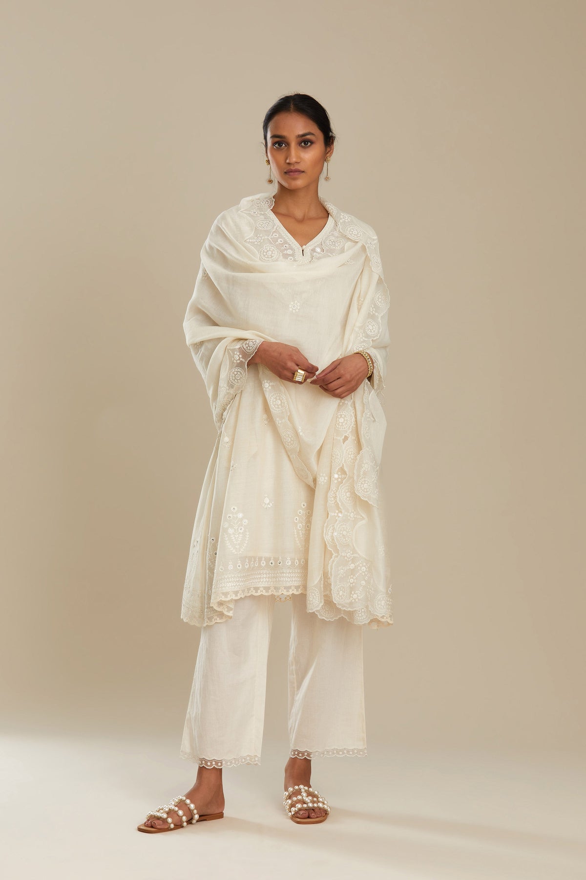 Cotton chanderi easy fit short V neck kurta set with tonal silk thread embroidery, highlighted with sequin and beads.