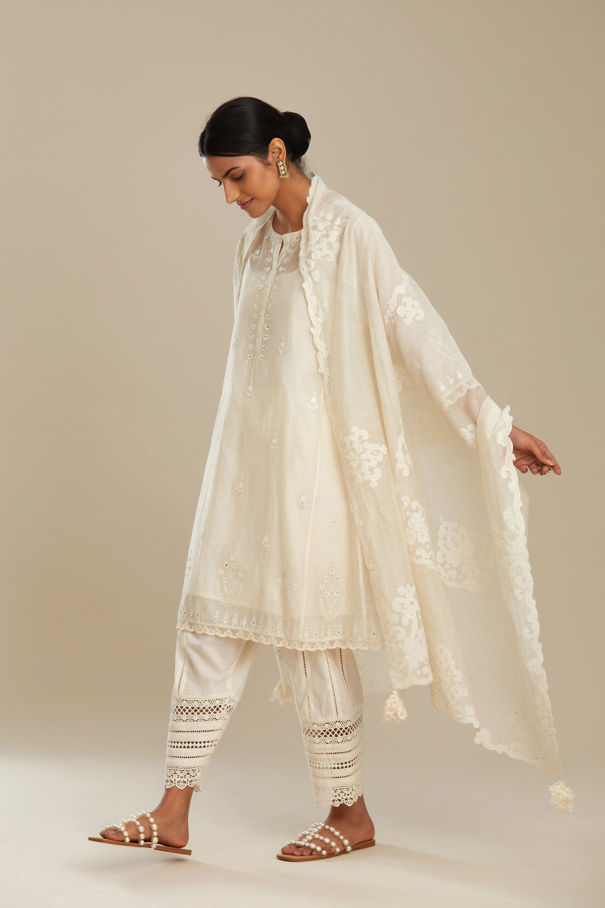 Off white cotton chanderi dupatta with cotton appliqué embroidery and sequin detail. (Dupatta)