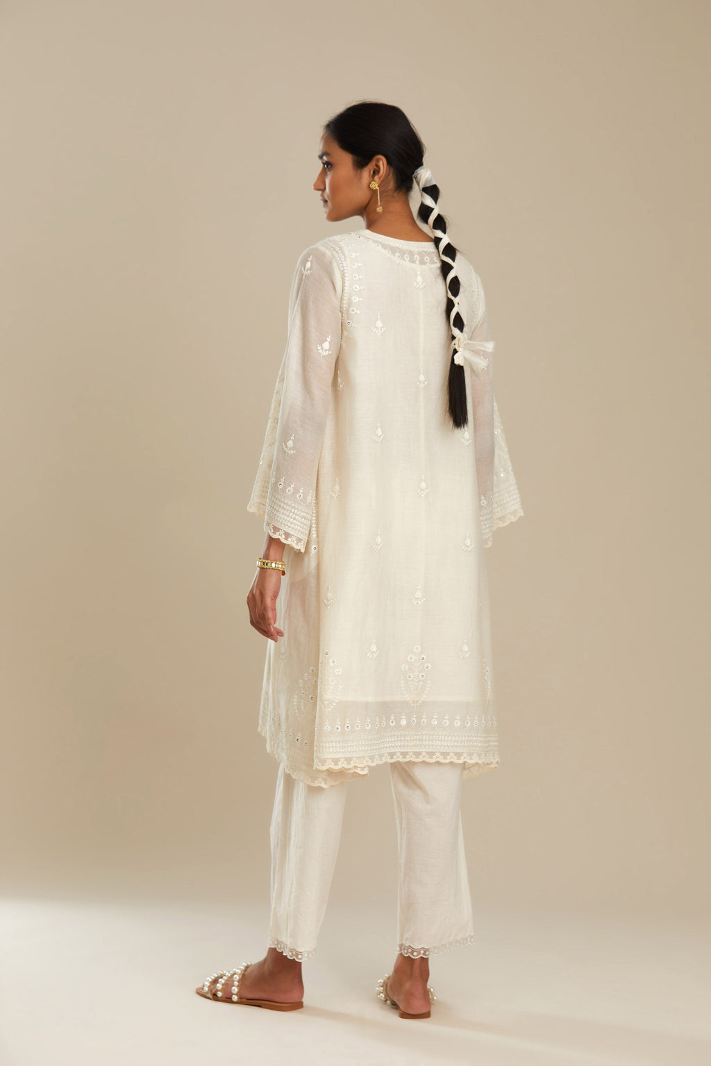 Cotton chanderi easy fit short V neck kurta set with tonal silk thread embroidery, highlighted with sequin and beads.