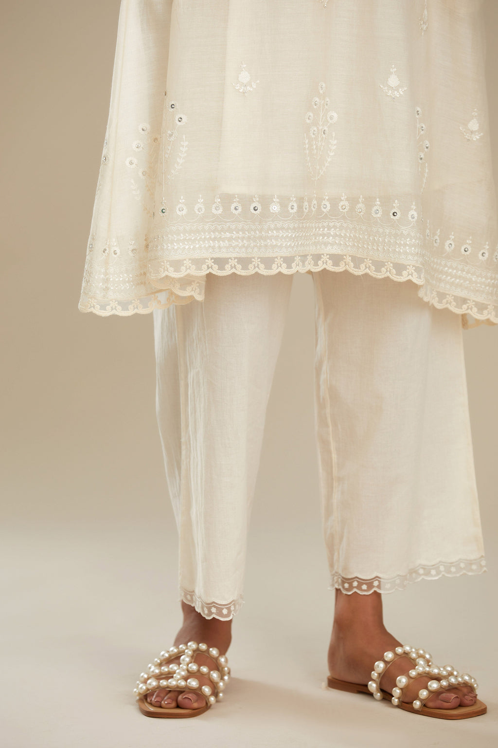 Cotton chanderi easy fit short V neck kurta set with tonal silk thread embroidery, highlighted with sequin and beads.