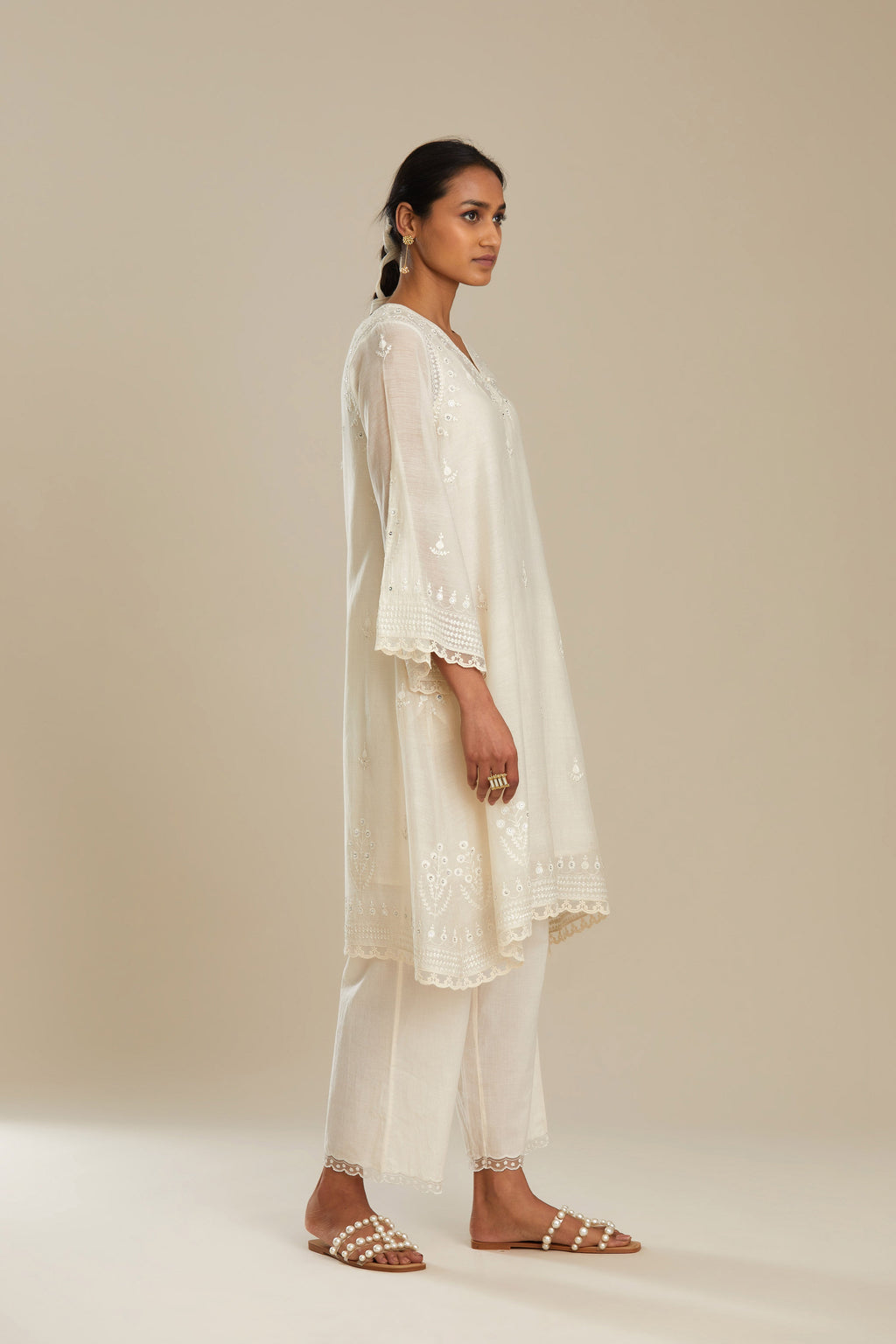 Cotton chanderi easy fit short V neck kurta set with tonal silk thread embroidery, highlighted with sequin and beads.