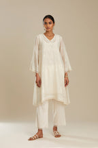 Cotton chanderi easy fit short V neck kurta set with tonal silk thread embroidery, highlighted with sequin and beads.