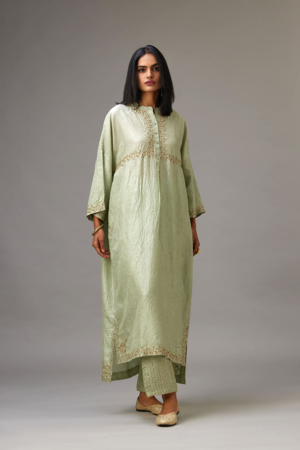 Green hand crushed silk free size kaftan set, highlighted with gold sequins and zari handwork.