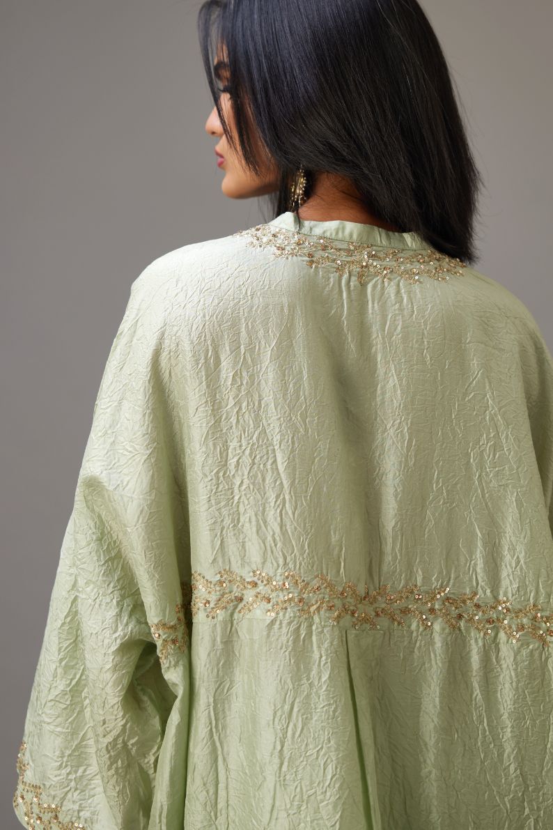 Green hand crushed silk free size kaftan set, highlighted with gold sequins and zari handwork.