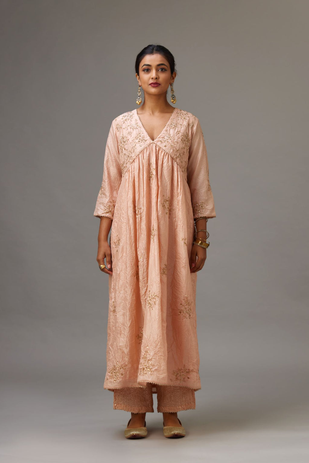 Pink silk hand crushed V neck gathered kurta set, highlighted with all-over gold sequins boota.