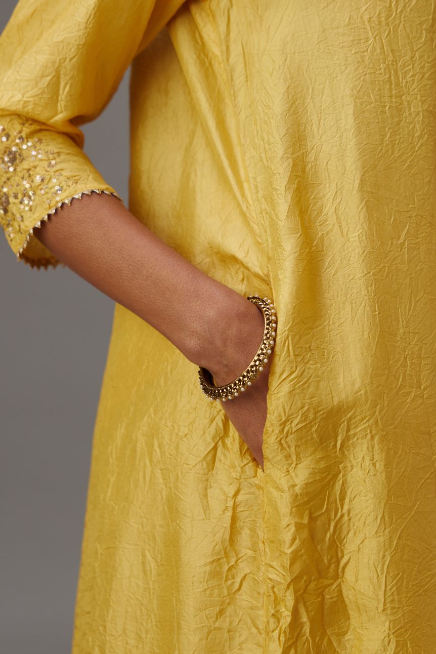 Yellow hand crushed silk kurta dress set with a V neck embroidered yoke and panels.
