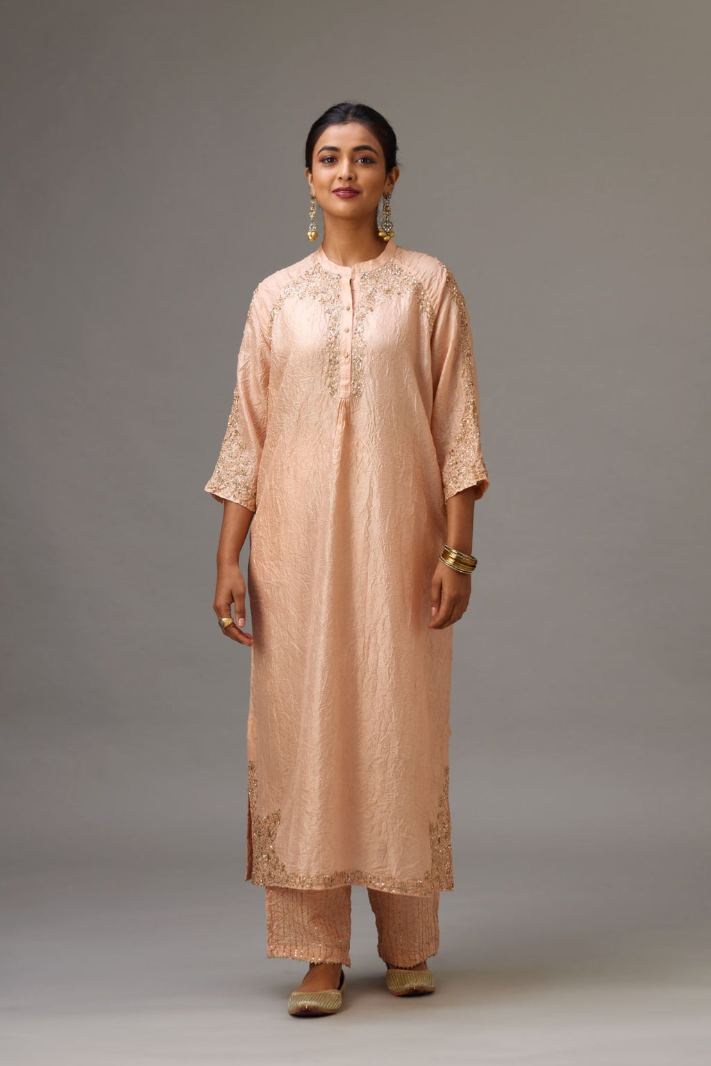 Pink silk hand crushed kurta set with button placket neckline, highlighted with gold sequins work at hem, neck and armhole.