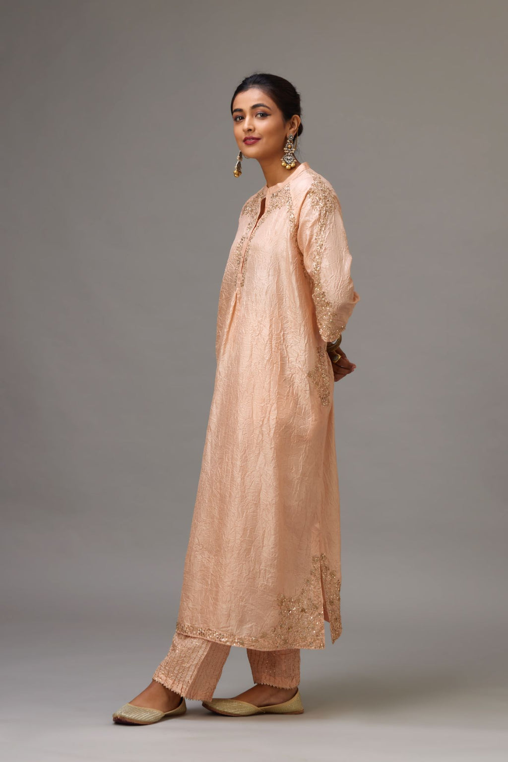 Pink silk hand crushed kurta set with button placket neckline, highlighted with gold sequins work at hem, neck and armhole.