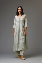 Blue silk hand crushed V neck gathered kurta set, highlighted with all-over gold sequins boota.