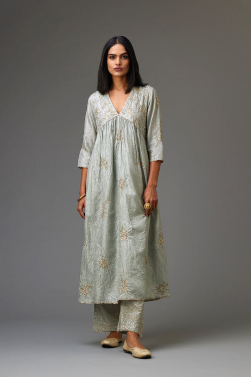 Blue silk hand crushed V neck gathered kurta set, highlighted with all-over gold sequins boota.