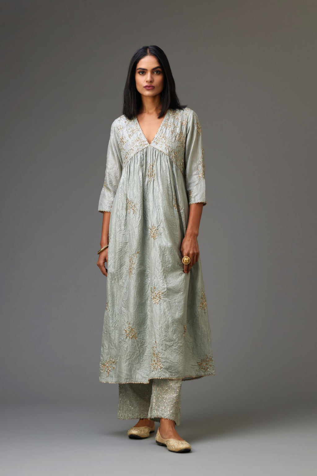 Blue silk hand crushed V neck gathered kurta set, highlighted with all-over gold sequins boota.