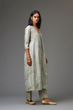 Blue silk hand crushed V neck gathered kurta set, highlighted with all-over gold sequins boota.