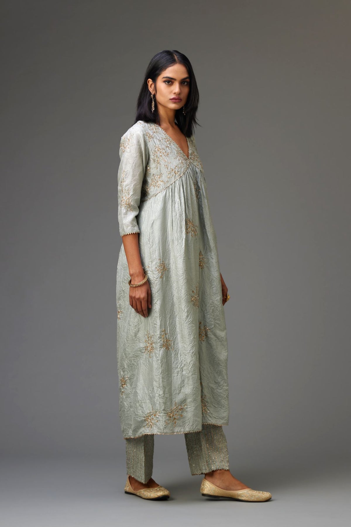 Blue silk hand crushed V neck gathered kurta set, highlighted with all-over gold sequins boota.
