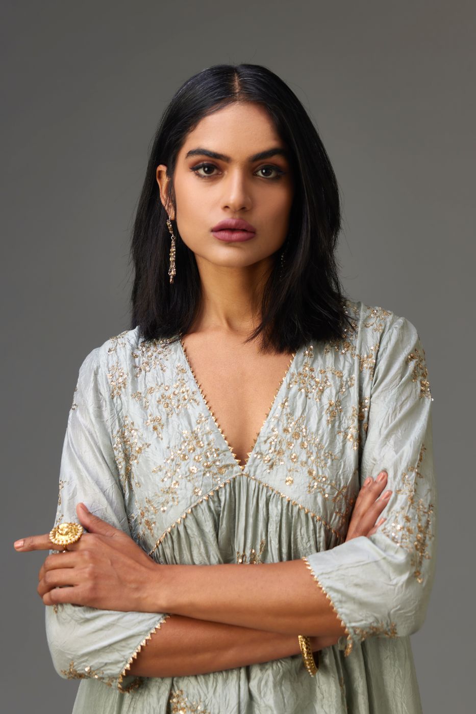 Blue silk hand crushed V neck gathered kurta set, highlighted with all-over gold sequins boota.
