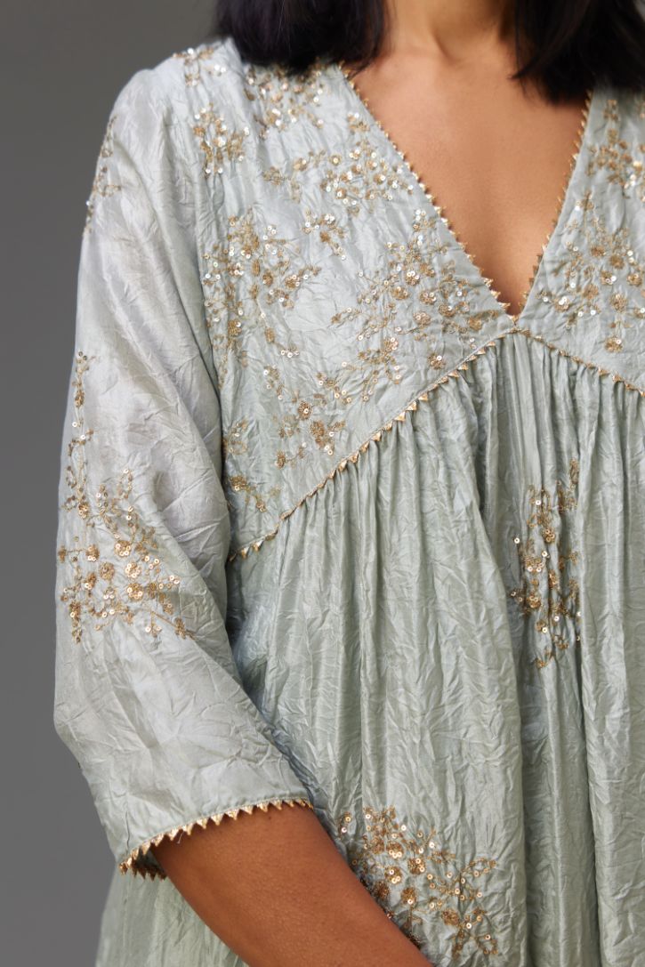 Blue silk hand crushed V neck gathered kurta set, highlighted with all-over gold sequins boota.
