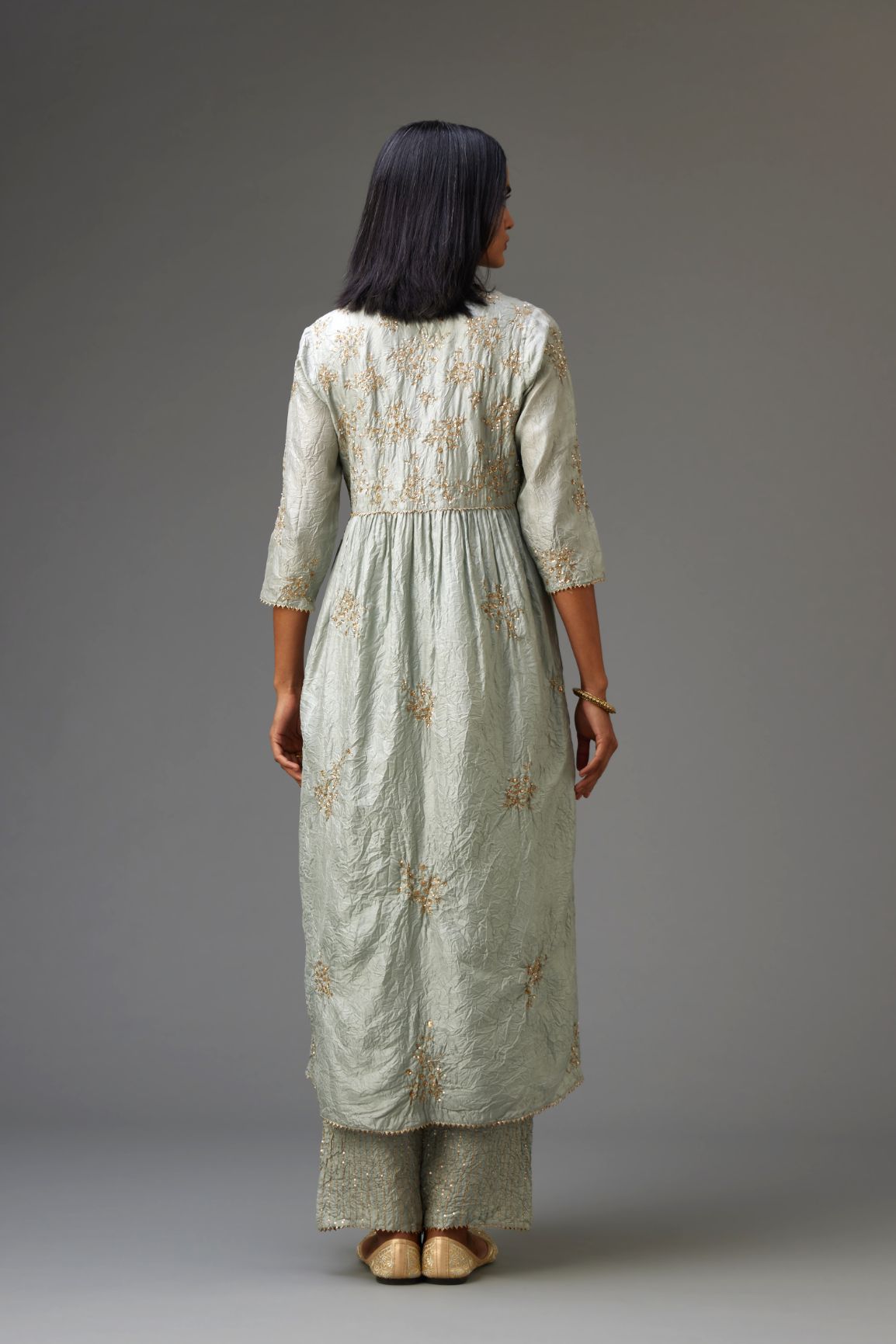 Blue silk hand crushed V neck gathered kurta set, highlighted with all-over gold sequins boota.