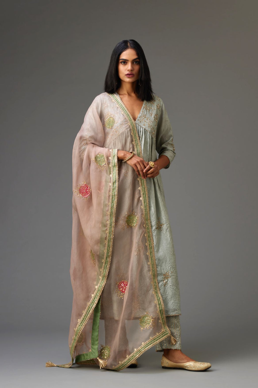 Blue silk hand crushed V neck gathered kurta set, highlighted with all-over gold sequins boota.