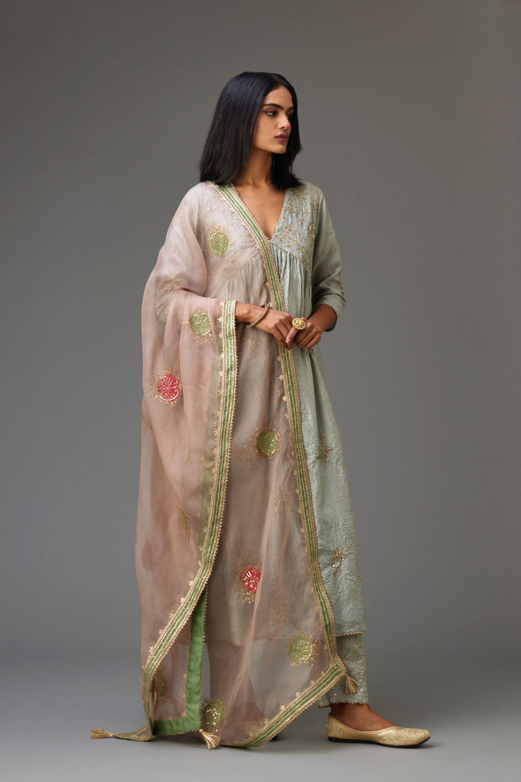 Blue silk hand crushed V neck gathered kurta set, highlighted with all-over gold sequins boota.