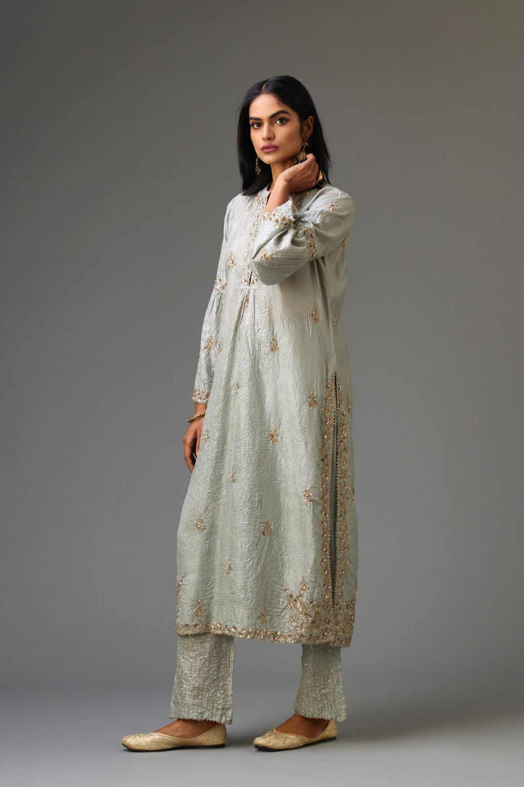 Blue hand crushed silk straight kurta set with all-over gold sequins and zari handwork, highlighted with gota lace at edges.