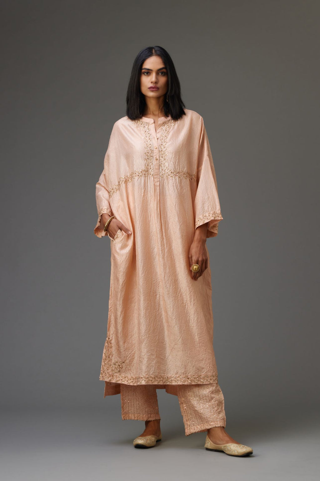 Pink hand crushed silk free size kaftan set, highlighted with gold sequins and zari handwork.