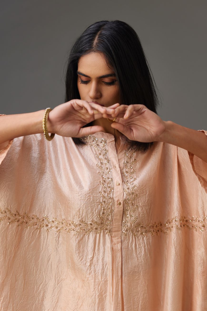 Pink hand crushed silk free size kaftan set, highlighted with gold sequins and zari handwork.