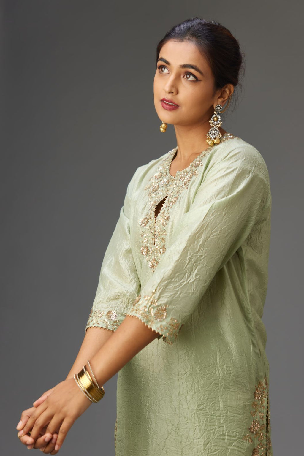 Green hand crushed silk straight kurta set highlighted with gold sequins and zari handwork.