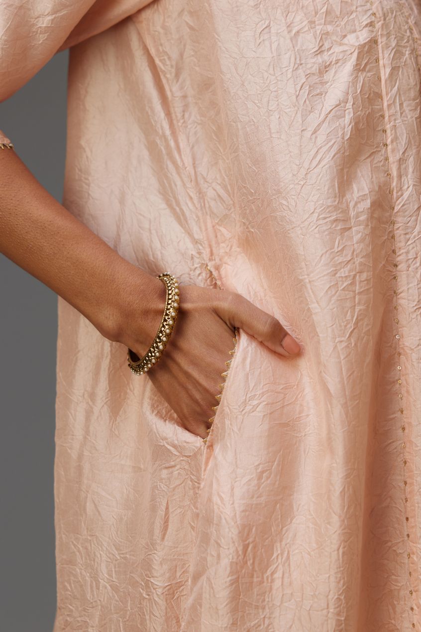 Pink hand crushed silk kurta dress set with a V neck embroidered yoke and panels.