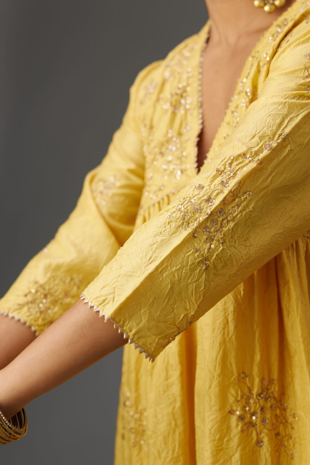 Yellow silk hand crushed V neck gathered kurta set, highlighted with all-over gold sequins boota.