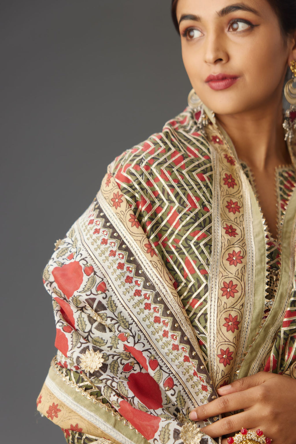 Silk chanderi hand block printed lehenga choli set with all-over gota detailing.