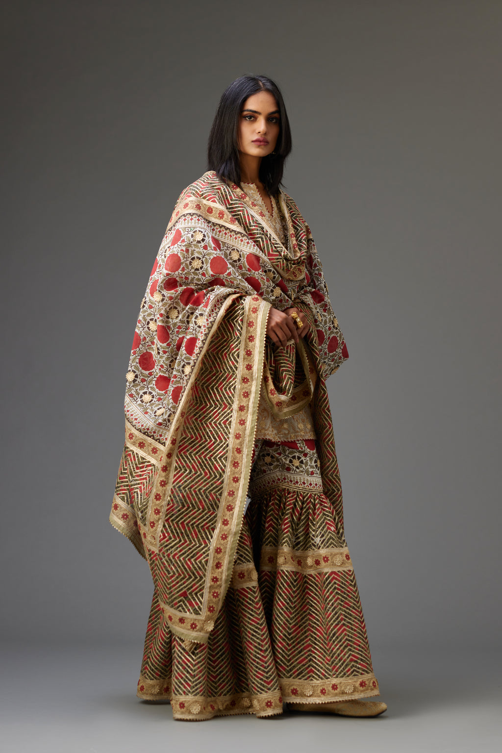 Hand block printed silk chanderi dupatta with all-over gota flowers and heavy embroidered herringbone pattern at the borders.