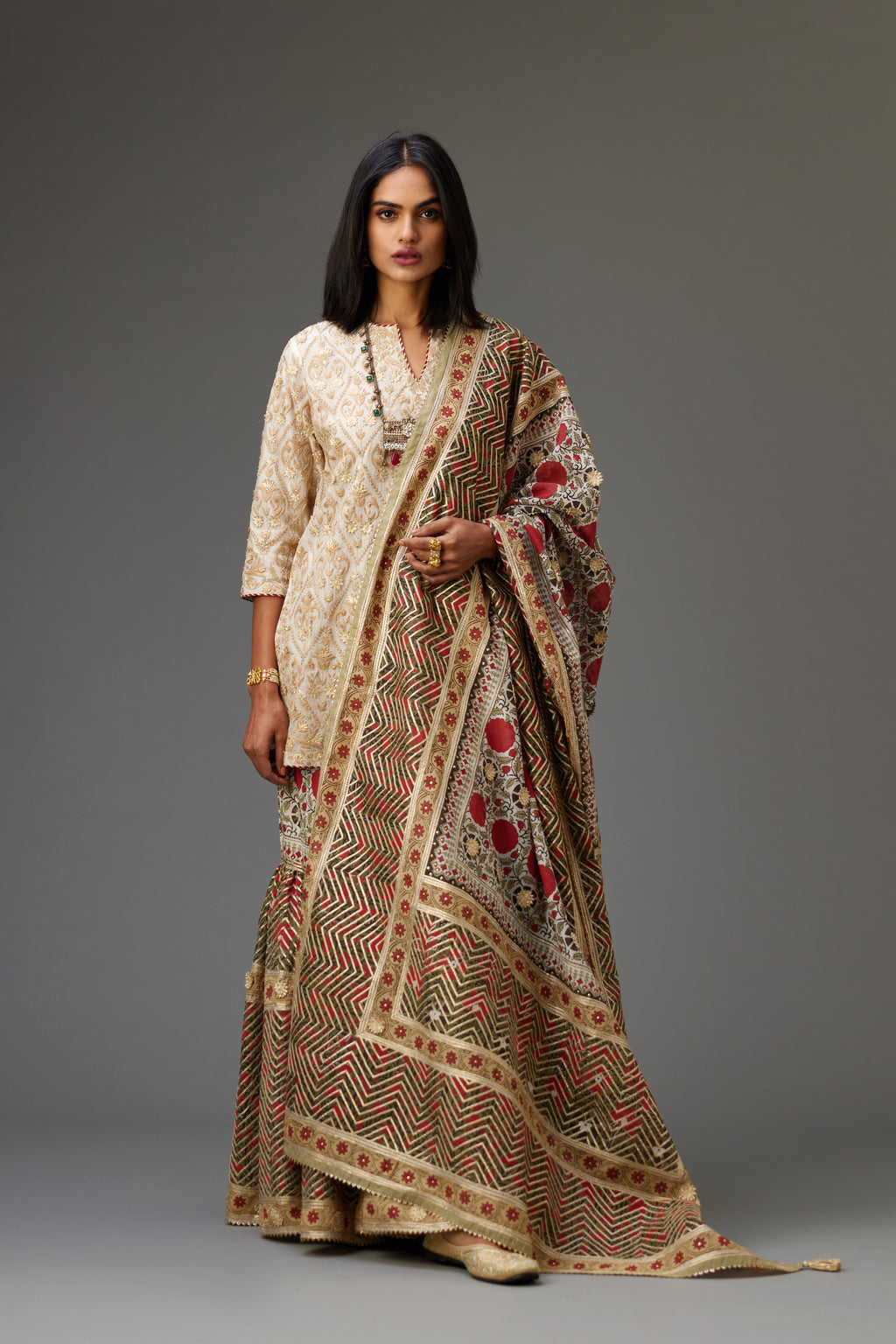 Hand block printed silk chanderi dupatta with all-over gota flowers and heavy embroidered herringbone pattern at the borders.