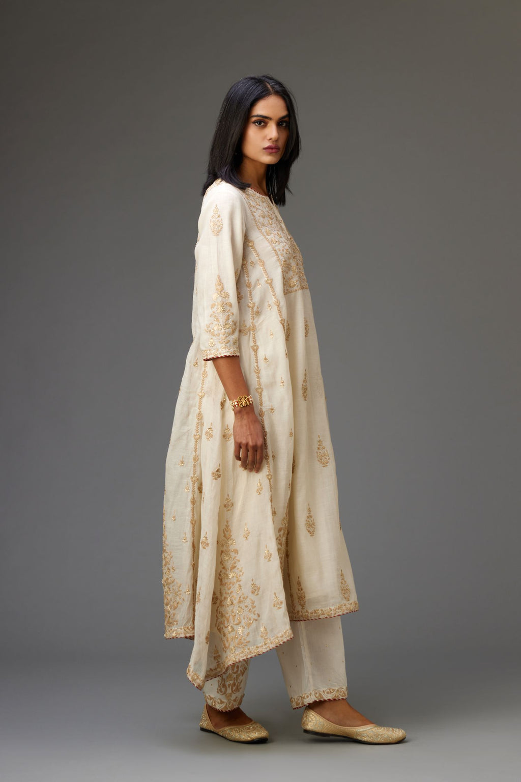 Off white A-line long kurta set with all-over dori, sequins and gota embroidery.