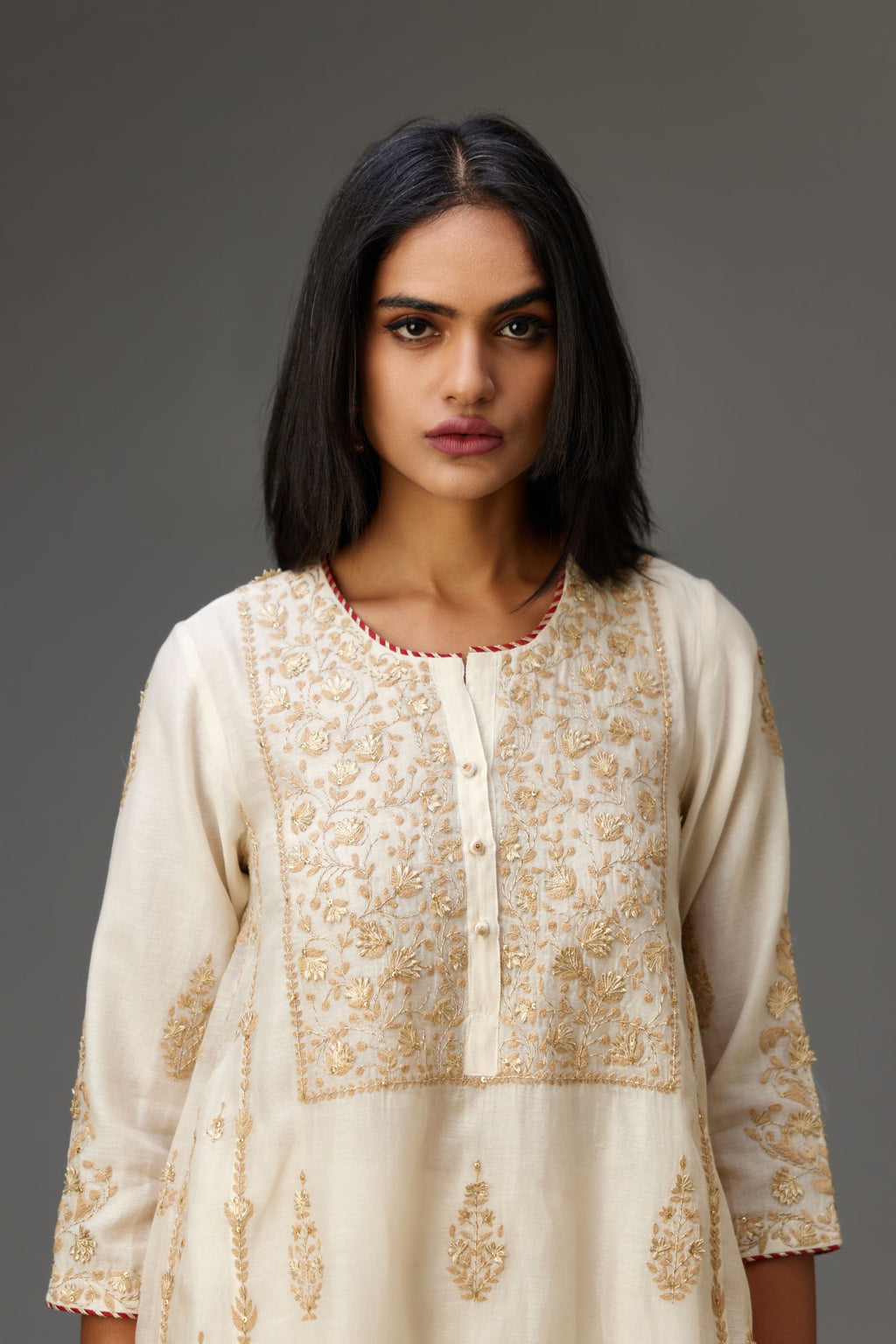 Off white A-line long kurta set with all-over dori, sequins and gota embroidery.