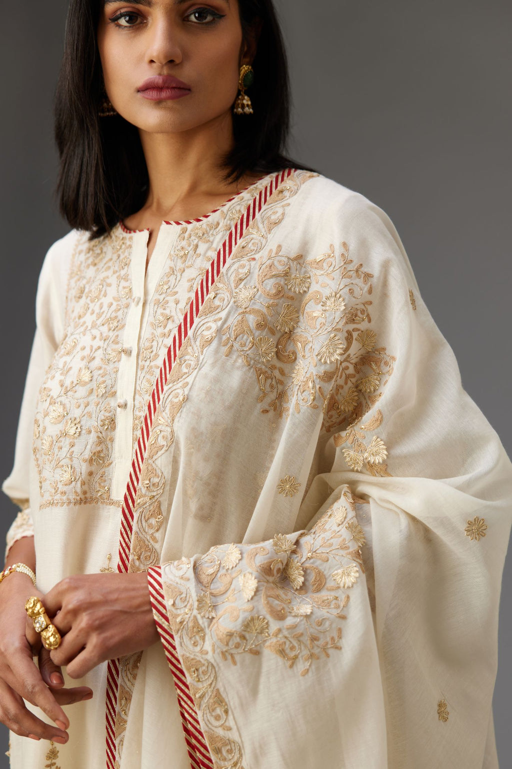 Off white A-line long kurta set with all-over dori, sequins and gota embroidery.