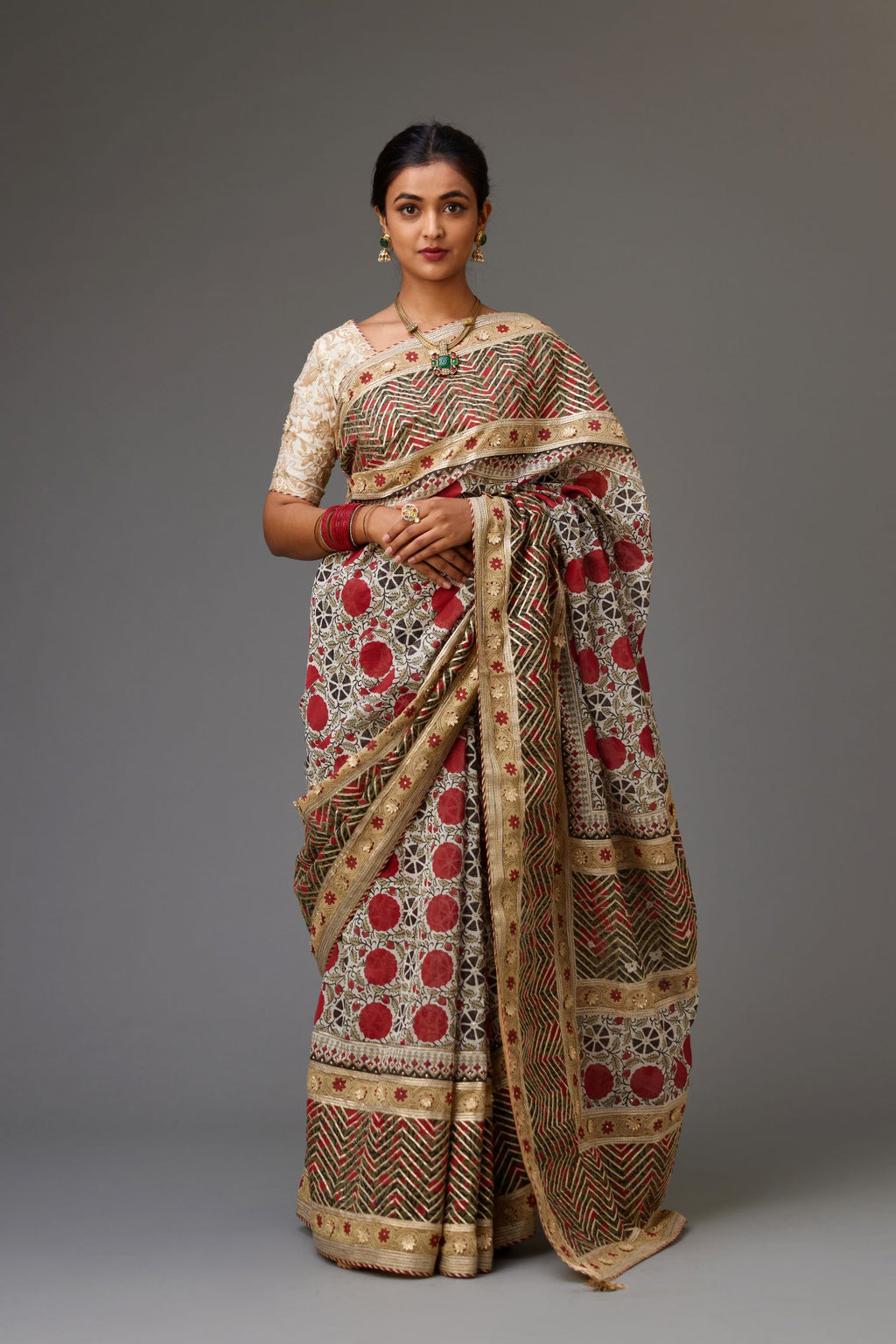 Silk chanderi red and off-white hand block printed saree set, Detailed with gota flowers and gold sequin work, paired with off white cotton chanderi fully embroidered choli.