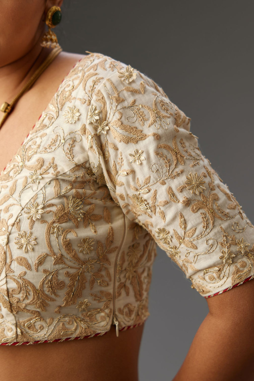 Off-white cotton chanderi blouse & lehenga set with all over dori & gota work.